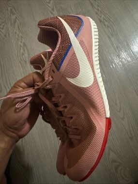 Nike Men's Pink and White Athletic Shoes with Blue Accent